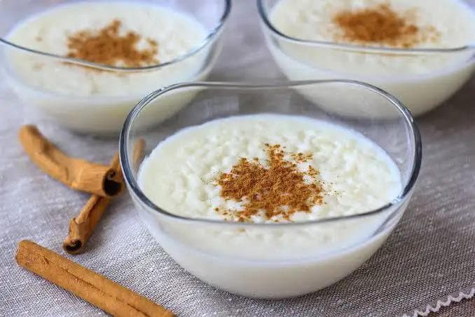 Bowls of rice pudding dusted with cinnamon